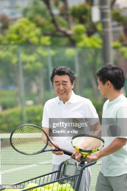 two men who play tennis - japanese tennis stock pictures, royalty-free photos & images