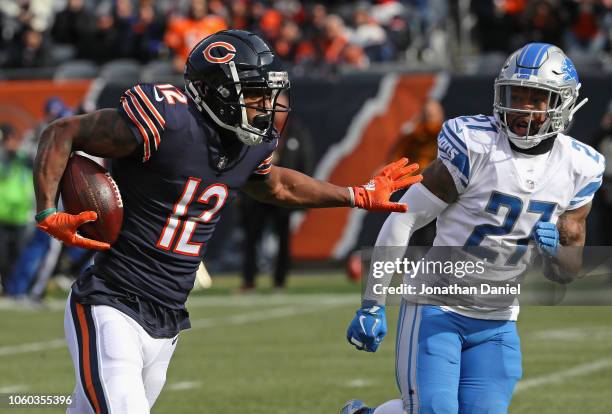 Allen Robinson of the Chicago Bears runs past Glover Quin of the Detroit Lions for a first down at Soldier Field on November 11, 2018 in Chicago,...