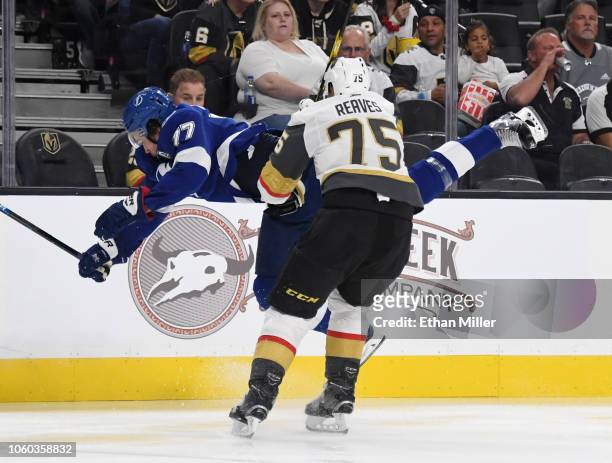 Ryan Reaves of the Vegas Golden Knights hits Victor Hedman of the Tampa Bay Lightning into the boards in the second period of their game at T-Mobile...