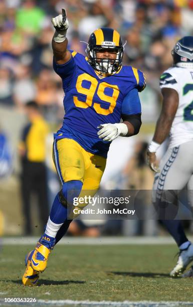 Aaron Donald of the Los Angeles Rams celebrates sacking Russell Wilson of the Seattle Seahawks in the at Los Angeles Memorial Coliseum on November...