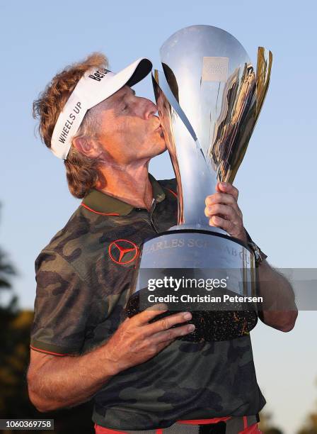 Bernhard Langer of Germany kisses the Charles Schwab Cup after winning the seaon long overall standings during the Charles Schwab Cup Championship at...