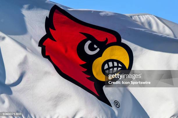 Flag waves in the wind displaying the Louisville Cardinals logo during the ACC Men's Soccer Championship between the North Carolina Tar Heels and the...