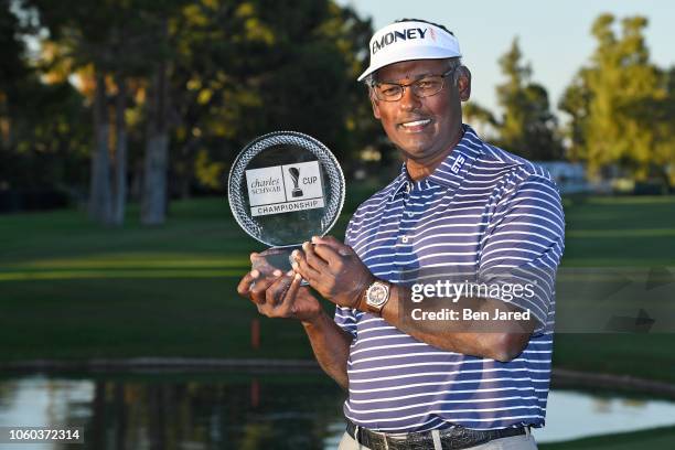 Vijay Singh of Fiji holds the Charles Schwab Cup Championship tournament trophy during the final round of the PGA TOUR Champions Charles Schwab Cup...
