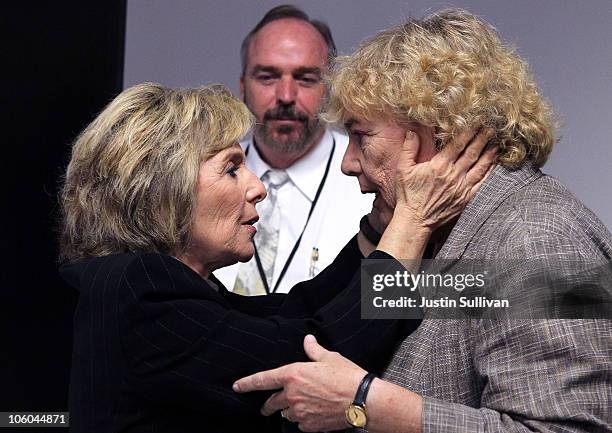 Sen. Barbara Boxer embraces U.S. Rep. Zoe Lofgren as Stion CEO Chet Ferris looks on during a news conference following a tour of the Stion production...