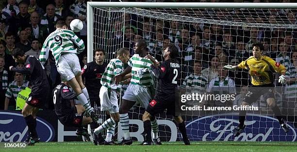 Chris Sutton of Celtic heads in the second goal during the Champions League game between Celtic and Juventus at Celtic Park in Glasgow. DIGITAL...