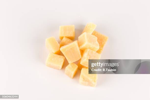 hard cheese isolated on a white background - cheese cubes stock pictures, royalty-free photos & images