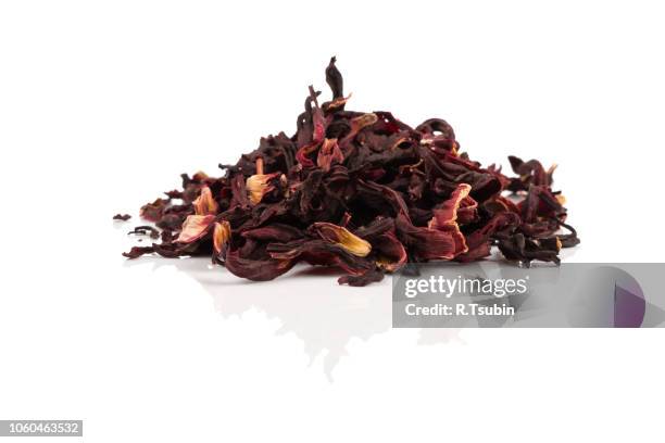 heap of aromatic hibiscus tea - hibiscus flower stock-fotos und bilder