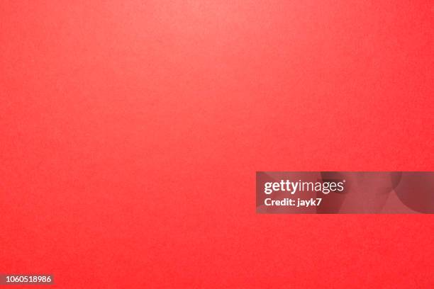 red colored paper background - red texture stock-fotos und bilder