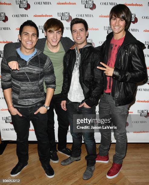 Carlos Pena Jr, Kendall Schmidt, Logan Henderson and James Maslow of 'Big Time Rush' sign autographs at Universal CityWalk on October 25, 2010 in...