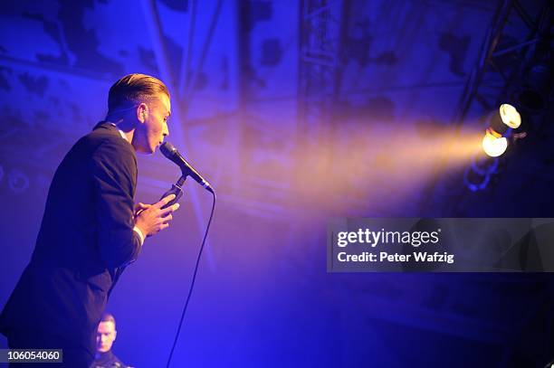 Theo Hutchcraft of Hurts performs on stage at the Essigfabrik on October 20, 2010 in Cologne, Germany.