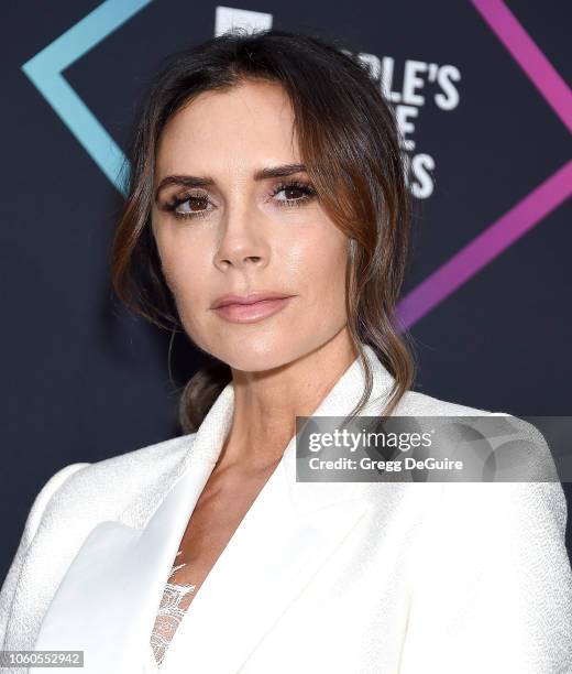 Victoria Beckham, recipient of the 2018 Fashion Icon Award, poses in the press room at the People's Choice Awards 2018 at Barker Hangar on November...