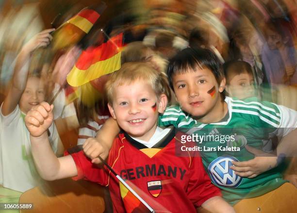 Pupils pose during a visit of the Women National Team of Germany at the Hans-Andersen-School on October 26, 2010 in Wolfsburg, Germany.