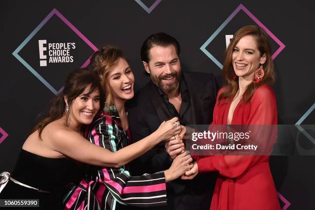 Emily Andras, Katherine Barrell, Tim Rozon and Melanie Scrofano attend the E! People's Choice Awards - Press Room at Barker Hangar on November 11,...