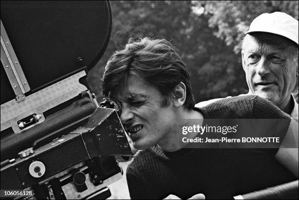French actor Alain Delon and director Julien Duvivier on the set of French-German film Diabolically Yours in 1976, in France.