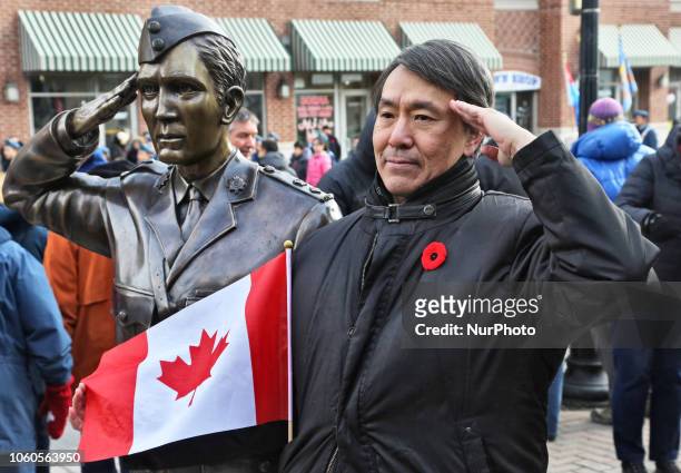 Canadians commemorate members of the military who served in past and present wars during a Remembrance Day ceremony held in Richmond Hill, Ontario,...