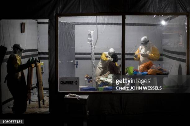 Health workers treat an unconfirmed Ebola patient, inside a MSF supported Ebola Treatment Centre on November 3, 2018 in Butembo, Democratic Republic...