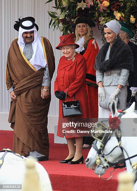 The Emir of the State of Qatar, Sheikh Hamad bin Khalifa al Thani and Sheikha Mozah Bint Nasser Al-Missned are greeted by Queen Elizabeth II on their...