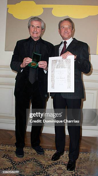 Director Claude Lelouch receives medal vermilion city of Paris from the Mayor of Paris Bertrand Delanoe at Mairie de Paris on October 26, 2010 in...