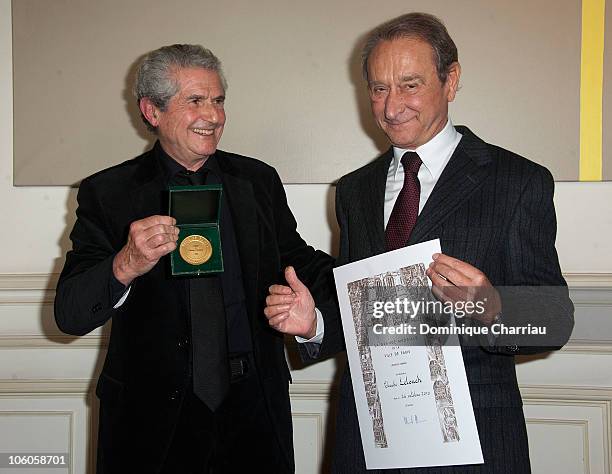 Director Claude Lelouch receives medal vermilion city of Paris from the Mayor of Paris Bertrand Delanoe at Mairie de Paris on October 26, 2010 in...