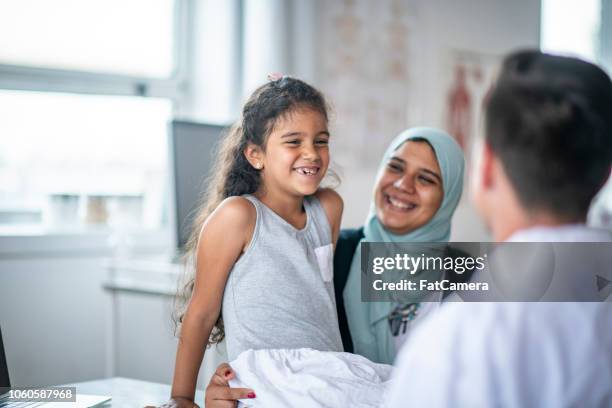 smiling together - refugee health stock pictures, royalty-free photos & images