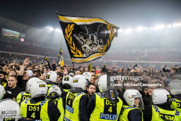 Supporters storm the pitch after winning the 2018 Allsvenskan season during an Allsvenskan match between Kalmar FF and AIK at Guldfageln Arena on...