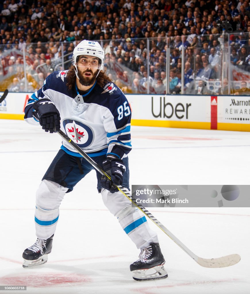 Toronto Maple Mathiue Mathieu Perreault of the Winnipeg Jets skates against the Toronto ...