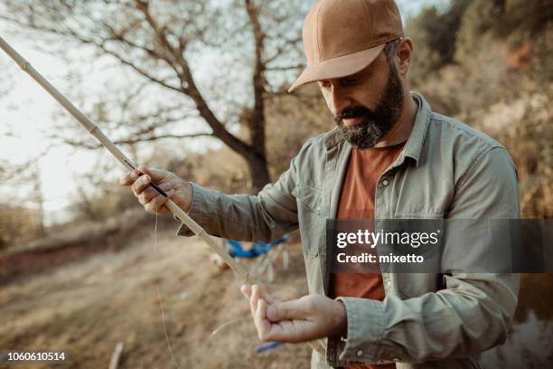 fisherman - fishing rod stock pictures, royalty-free photos & images
