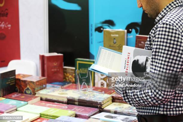 Visitors look at books on the third day of the 37th International Istanbul Book Fair on November 12, 2018 in Istanbul, Turkey. Organized by TUYAP...