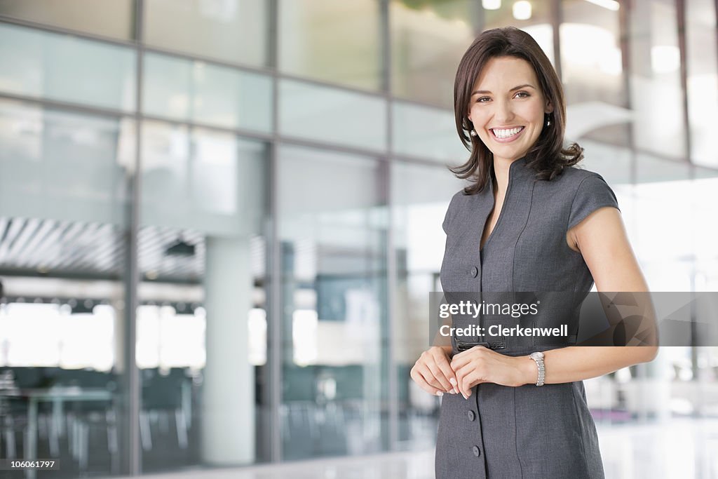 Portrait of a cheerful businesswoman in a office lobby