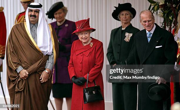 The Emir of the State of Qatar, Sheikh Hamad bin Khalifa Al-Thani, Queen Elizabeth II and Prince Philip, The Duke of Edinburgh at the ceremonial...