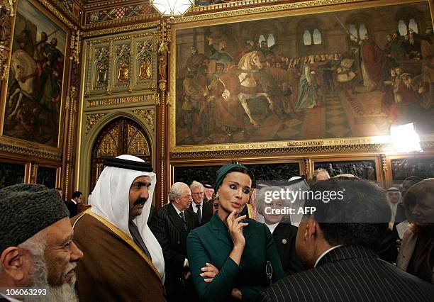 Qatar's emir, Sheikh Hamad bin Khalifa al-Thani, and his wife Sheikha Mozah , meet members of the All Party Parliamentary British-Qatar Group, during...