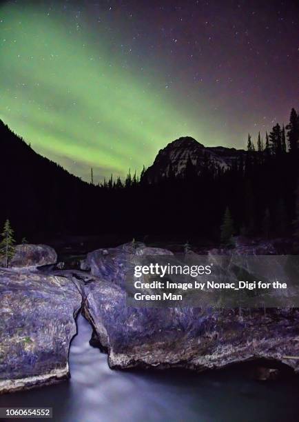aurora at the natural bridge - burgess shale stock pictures, royalty-free photos & images