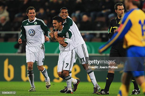 Josue of Wolfsburg celebrates with his team mates after scoring his team's second goal during the DFB Cup second round match between SC Victoria...