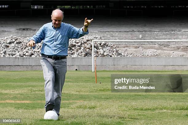 Presidential candidate of Brazil Jose Serra poses for photos during a visit to the renovation works of Maracana Stadium as part of his campaign on...