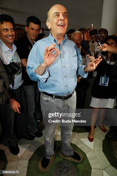 Presidential candidate of Brazil Jose Serra poses for photos during a visit to the renovation works of Maracana Stadium as part of his campaign on...