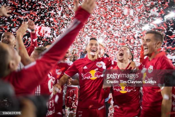 October 28: Sean Davis of New York Red Bulls, Alex Muyl of New York Red Bulls and Aaron Long of New York Red Bulls celebrate with tame mates after...