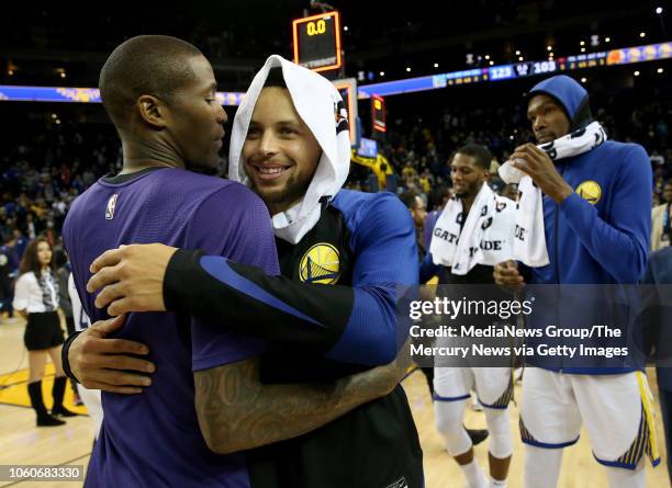 Golden State Warriors' Stephen Curry is congratulated by Phoenix Suns' Jamal Crawford after the Warriors 123-103 win over the Suns in their NBA game...