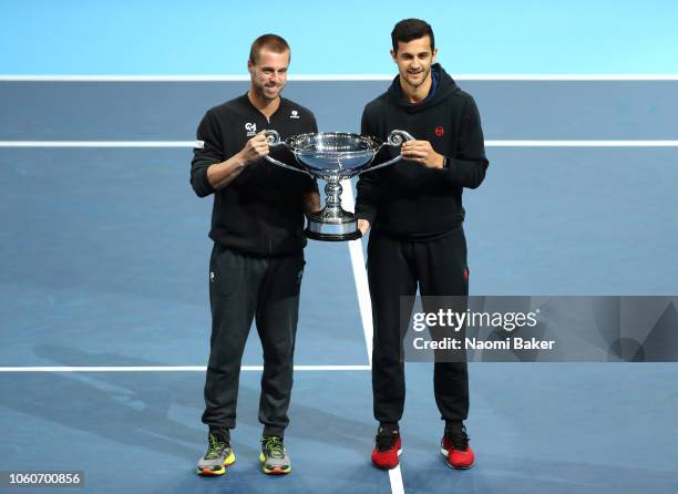 Mate Pavic of Croatia and partner Oliver Marach of Austria celebrate with their trophy as they are announced doubles world number one during Day Two...