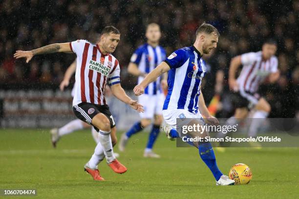 Tom Lees of Sheff Weds battles with Billy Sharp of Sheffield Utd during the Sky Bet Championship match between Sheffield United and Sheffield...