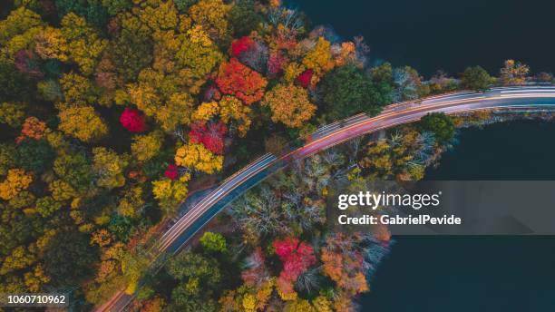 aerea view in the autumn of the road with passing cars - blue ridge parkway stock pictures, royalty-free photos & images