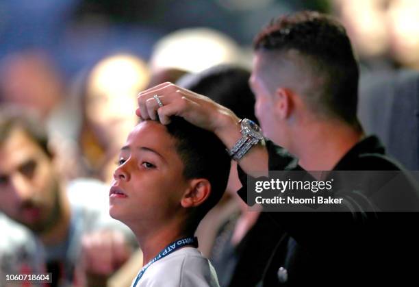 Cristiano Ronaldo and son Cristiano Ronaldo Jr. Watch on during the singles round robin match between Novak Djokovic of Serbia and John Isner of The...