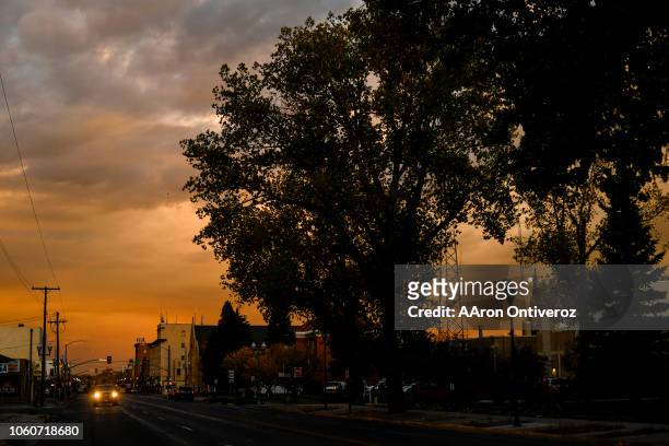The sun rises on Grand Avenue in front of the Albany County Courthouse during a dark, cloudy Laramie morning on Wednesday, October 4, 2018. On...