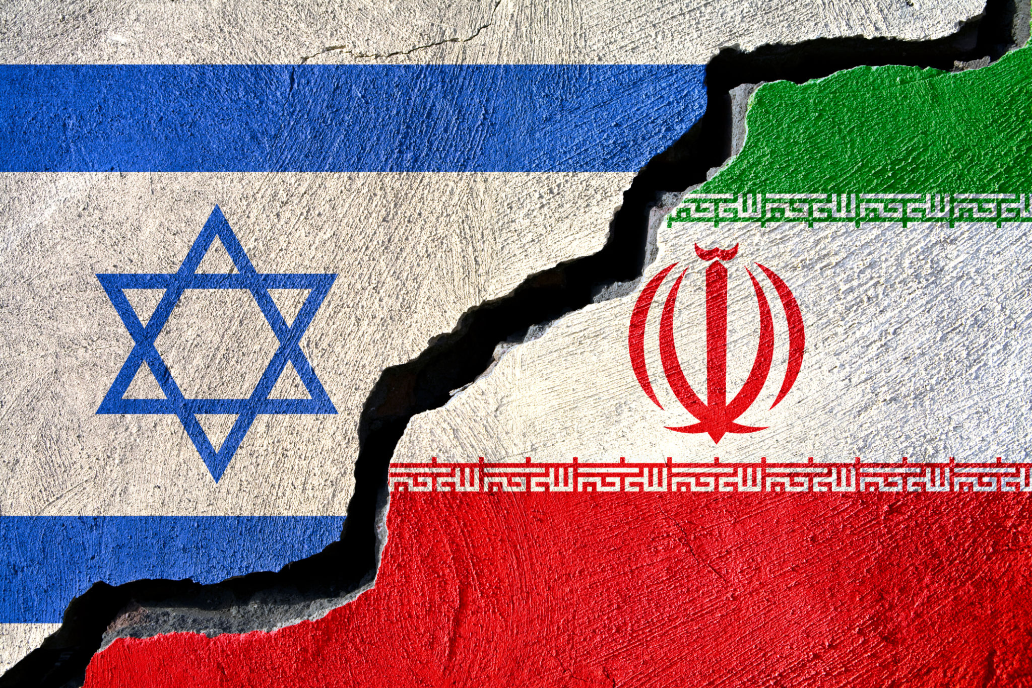 Concept Iran and Israel flag on cracked background Concept Iran and Israel flag on cracked background