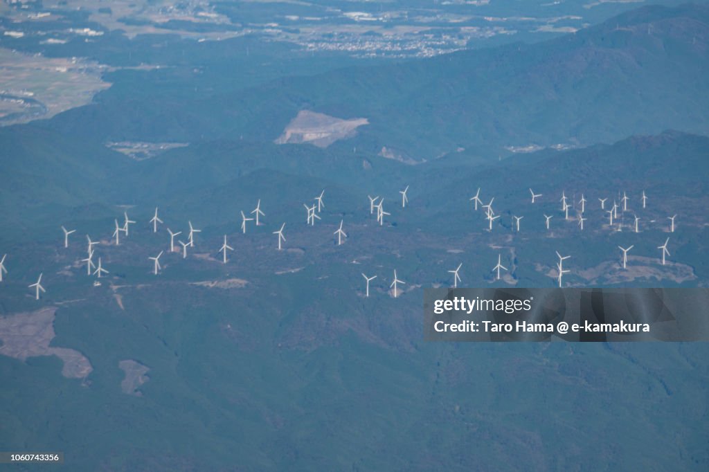 Too many wind power station on mountain in Tsu city in Mie prefecture in Japan daytime aerial view from airplane