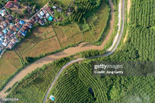 aerial view country village with mountain and mist fog during morning time in asia thailand - small farm stock pictures, royalty-free photos & images