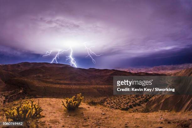 lightning strikes during a desert thunderstorm - julian stockfoto's en -beelden