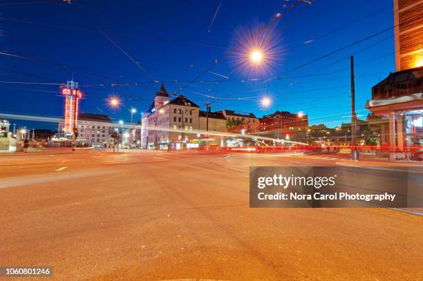 night view of jernbanetorget square street in oslo, norway - modern town square stock pictures, royalty-free photos & images