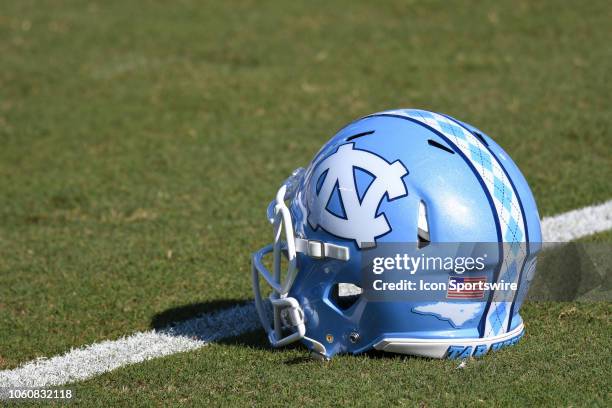 North Carolina Tar Heels helmet sits not the field during the college football game between North Carolina Tar Heels and the Duke Blue Devils on...