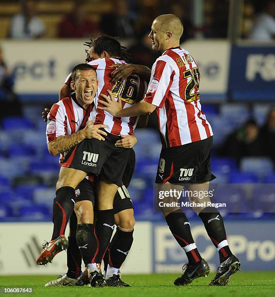 Sam Wood of Brentford is mobbed by team mates after scoring to make it 1-0 during the Carling Cup 4th round match between Birmingham City and...