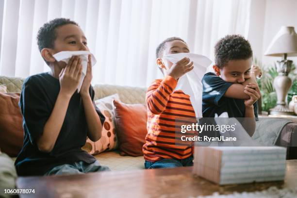 children sick with cold cough and sneeze at home - sneeze stock pictures, royalty-free photos & images